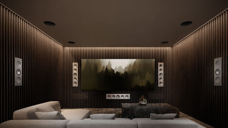 A modern home theater featuring a large screen and KEF two architectural speakers models: Ci5160RLM-THX (large) and Ci3160RLM-THX (small).